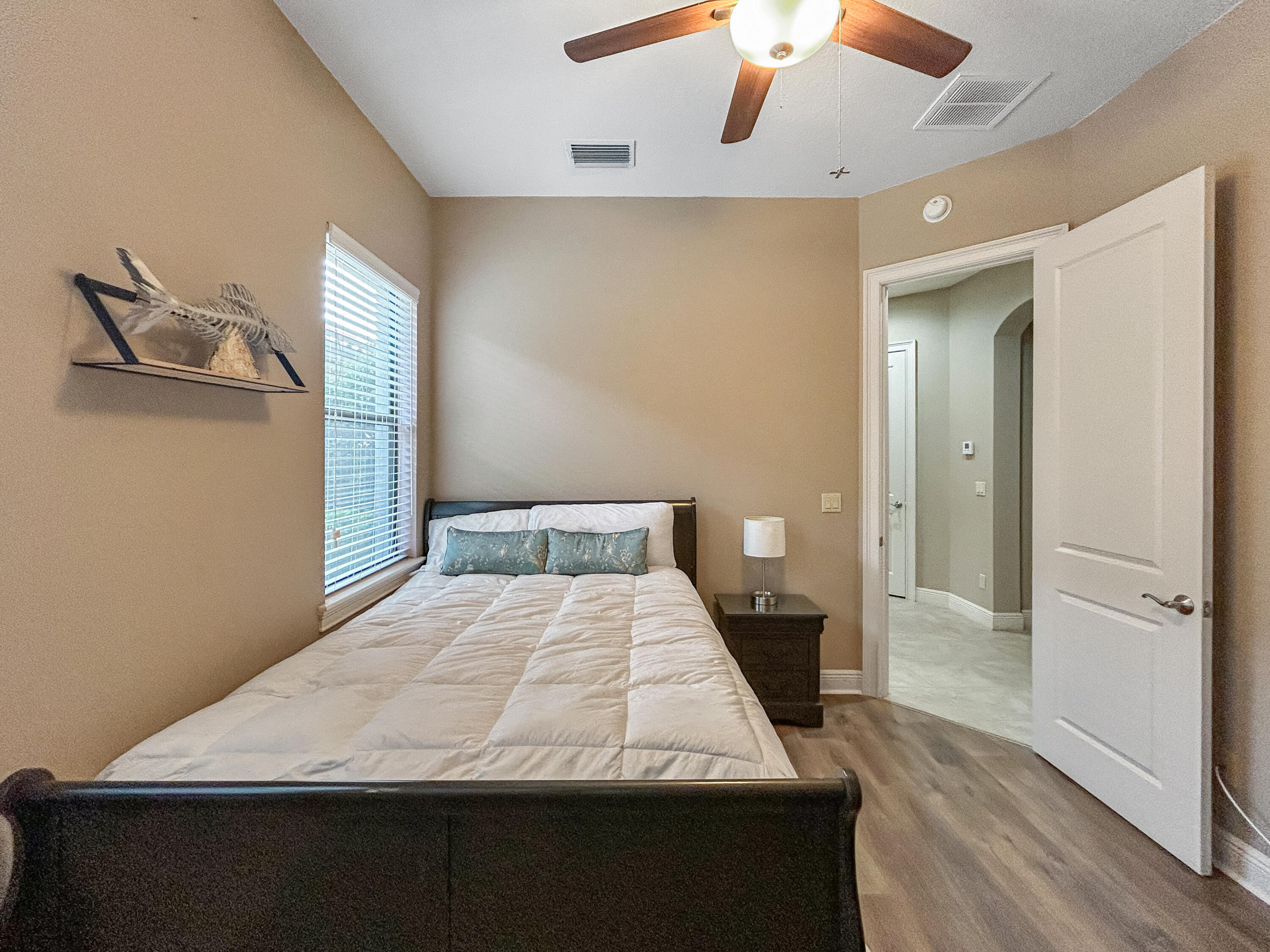 26345 San Gabriel Howey-in-the-Hills, FL 34737 - Photo 38 of 51 a large bed in a white room