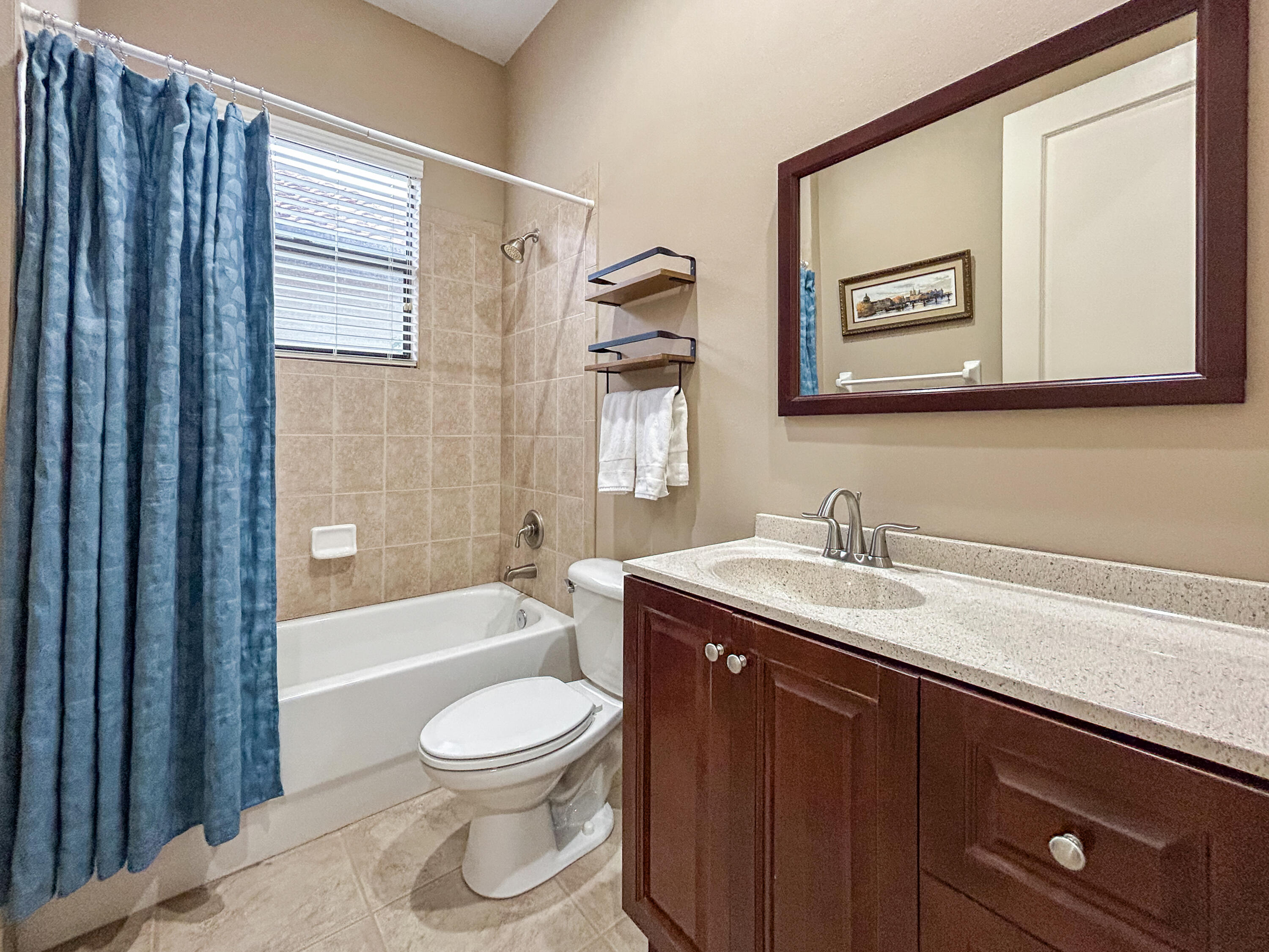 26345 San Gabriel Howey-in-the-Hills, FL 34737 - Photo 41 of 51 a bathroom with a toilet a sink a tub and mirror