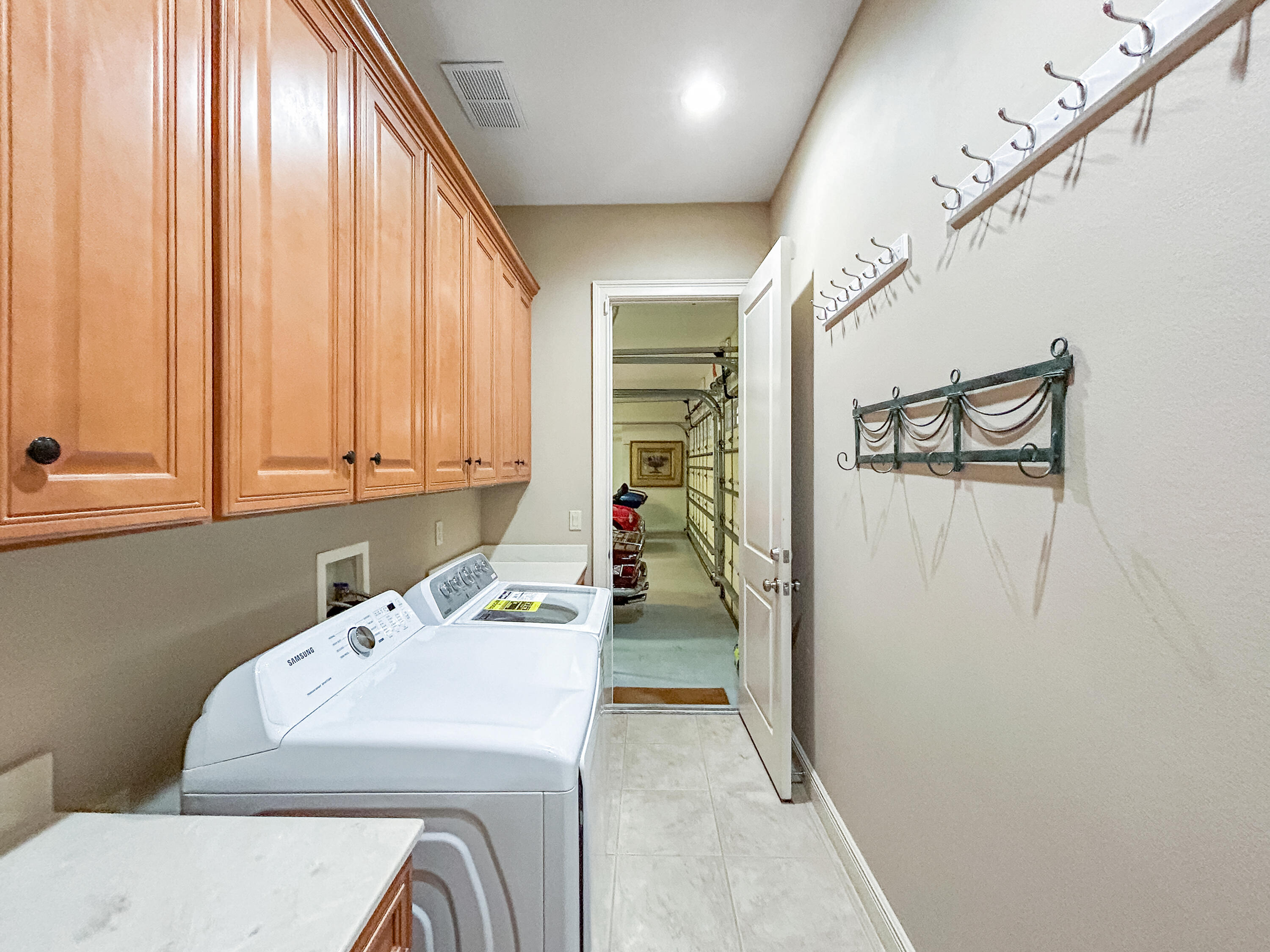 26345 San Gabriel Howey-in-the-Hills, FL 34737 - Photo 42 of 51 a utility room with dryer and washer