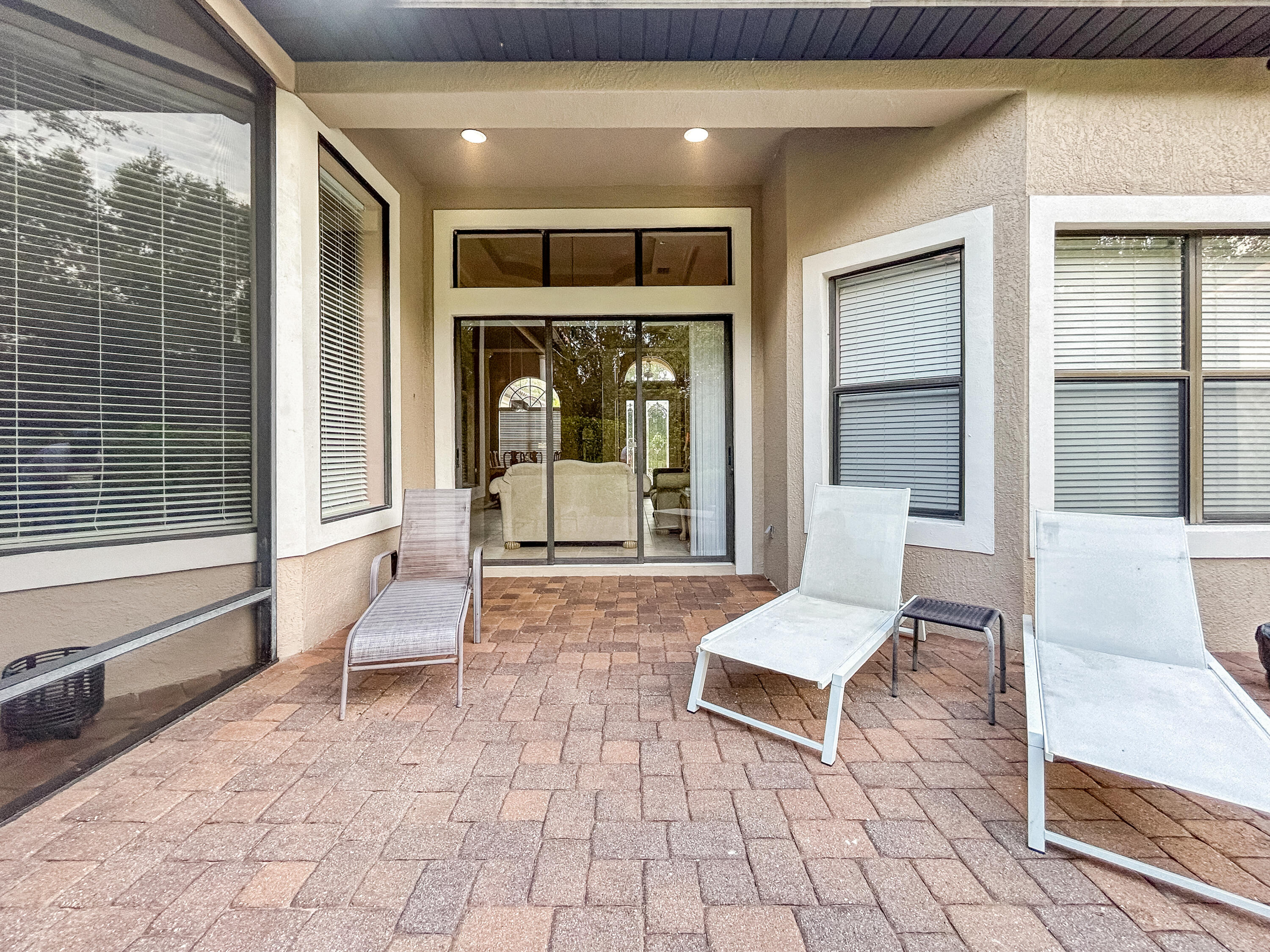 26345 San Gabriel Howey-in-the-Hills, FL 34737 - Photo 44 of 51 a living room with a large window and furniture