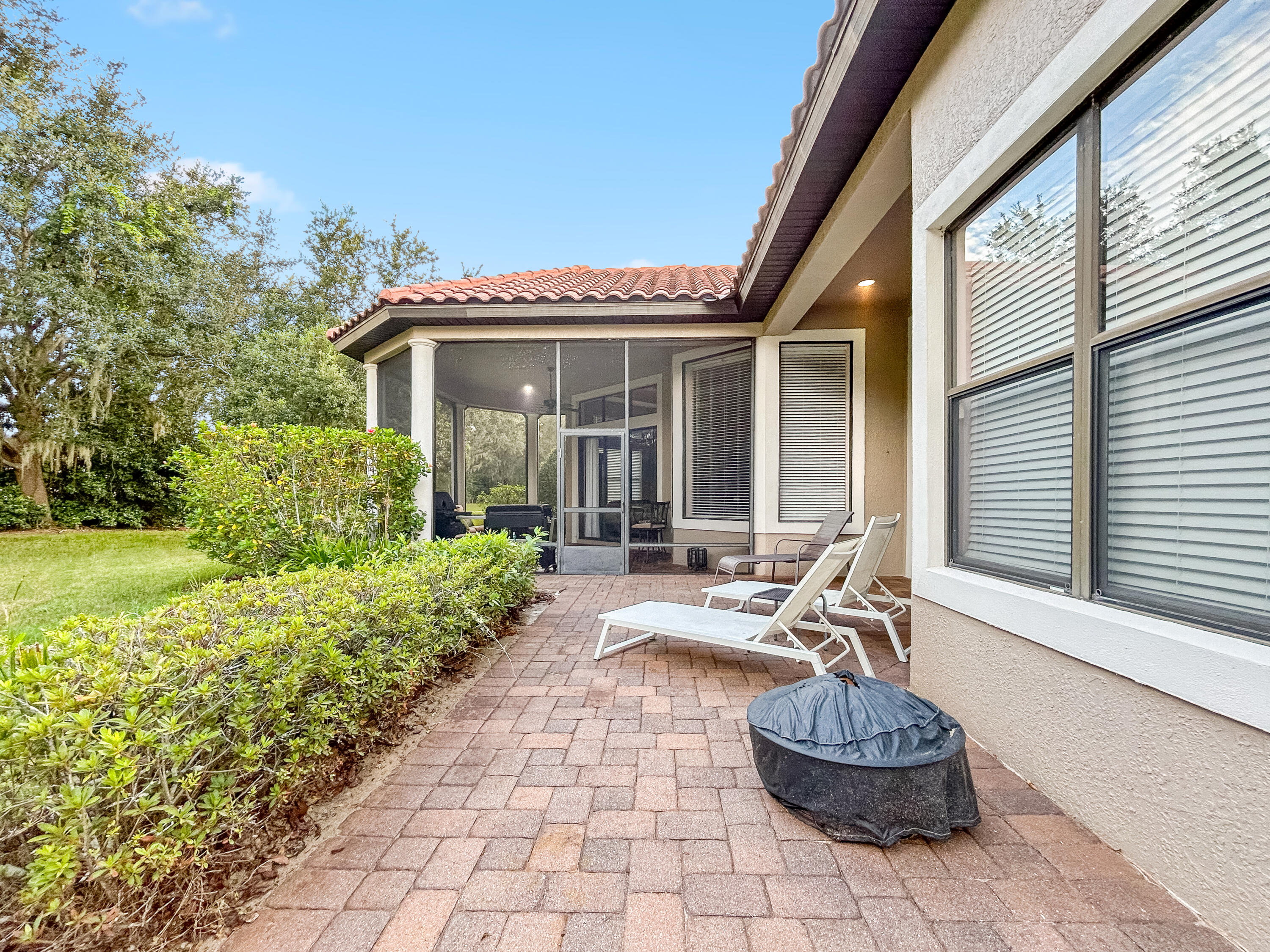 26345 San Gabriel Howey-in-the-Hills, FL 34737 - Photo 45 of 51 a view of a house with backyard and sitting area