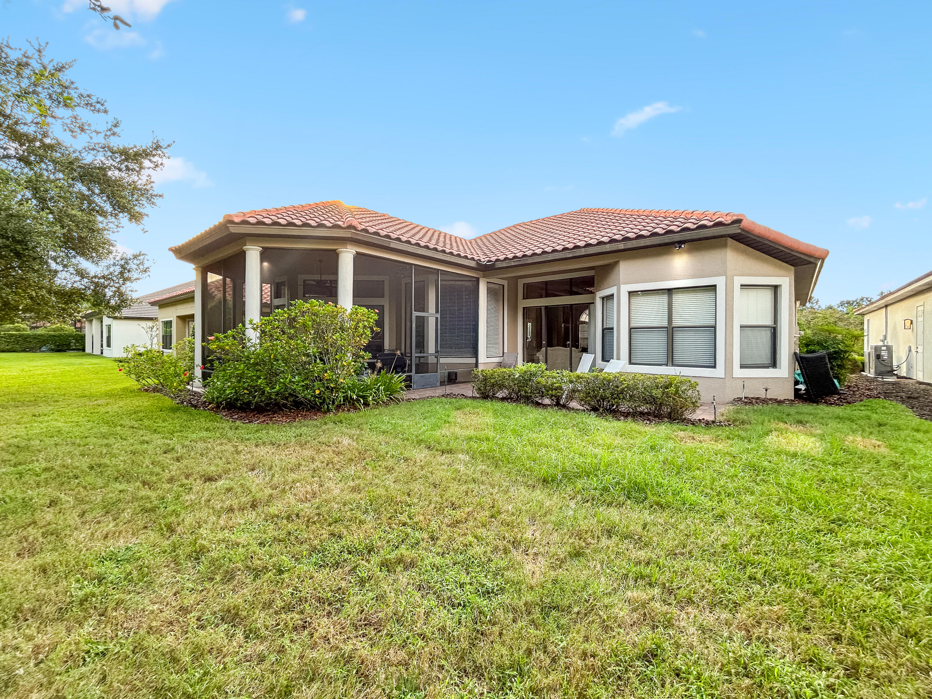 26345 San Gabriel Howey-in-the-Hills, FL 34737 - Photo 46 of 51 a front view of a house with garden