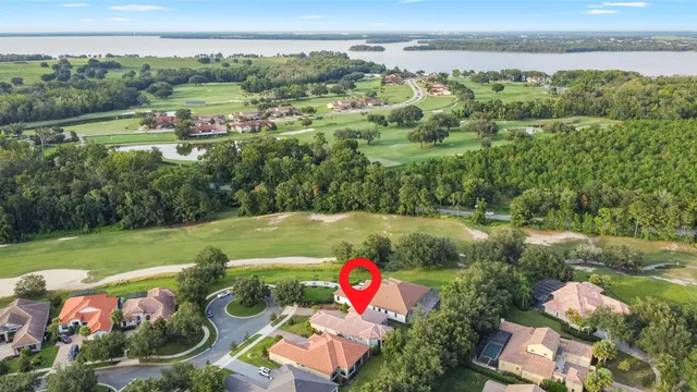 an aerial view of a house with swimming pool and garden view