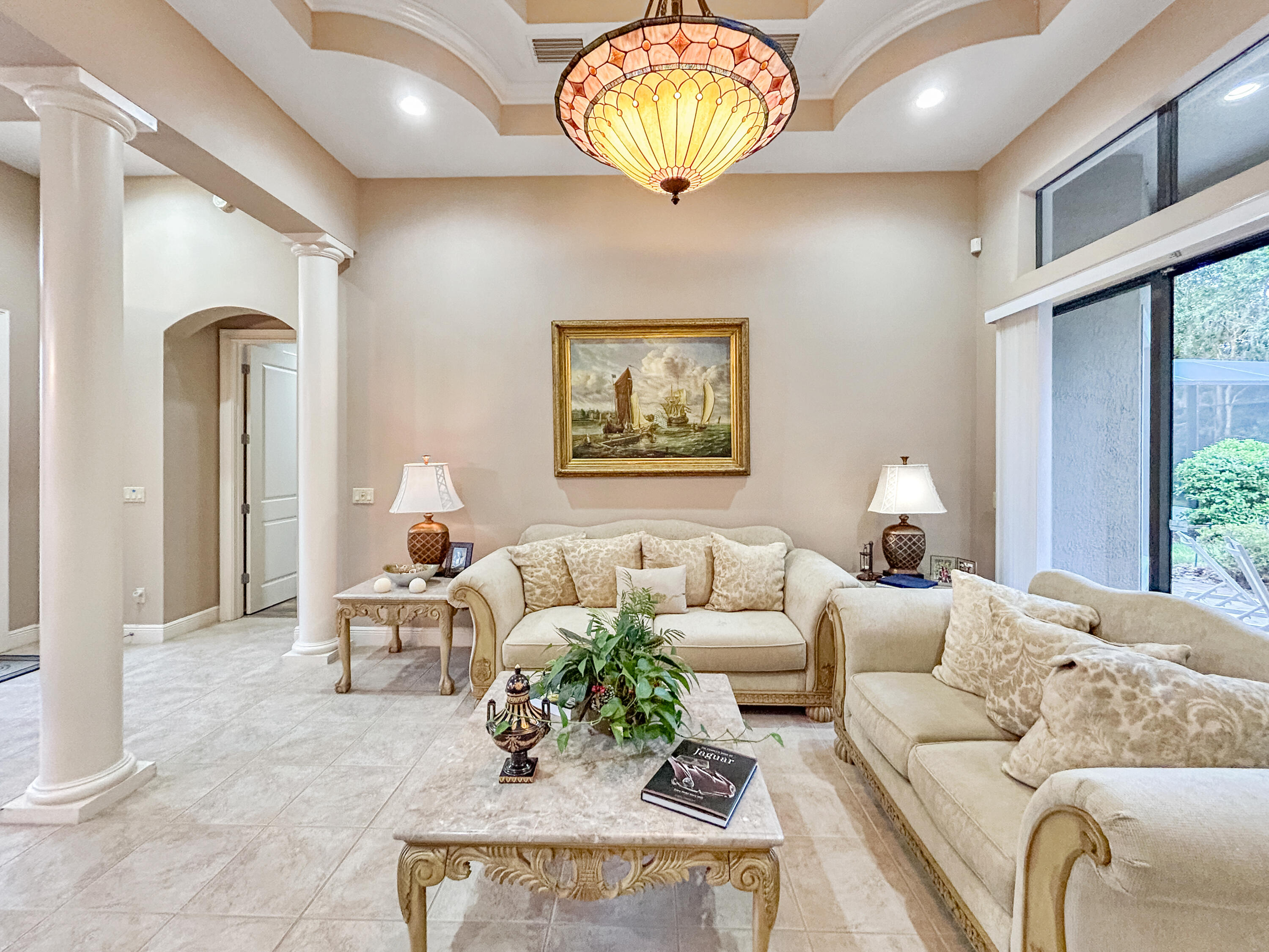 26345 San Gabriel Howey-in-the-Hills, FL 34737 - Photo 10 of 51 a living room with furniture chandelier and a window