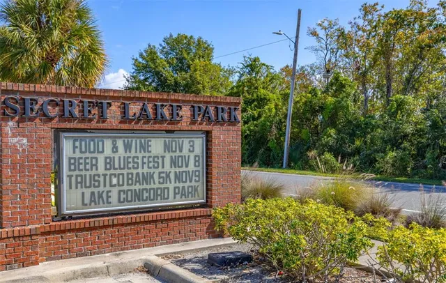 a view of a lake with couches in the patio