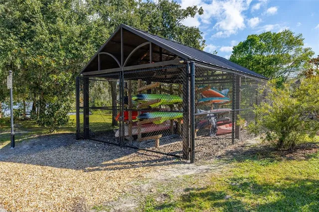 a view of a house with swimming pool and a yard