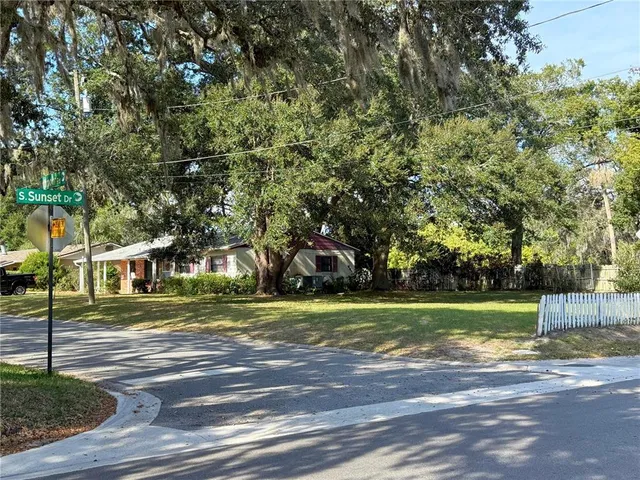 a view of outdoor space with trees all around