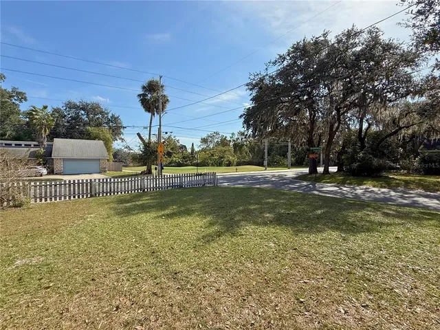 an aerial view of residential houses with city view