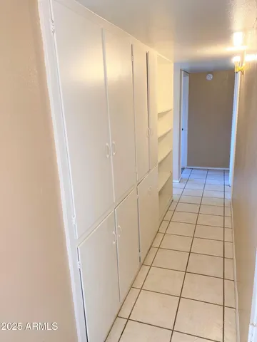 a bathroom with a shower and a mirror