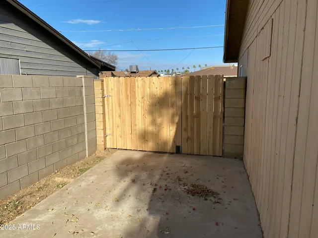 a view of a room with a wooden door