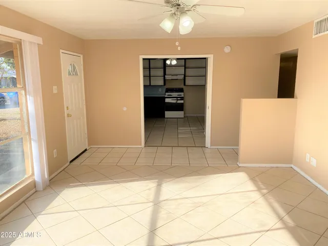 a view of an empty room with a bathroom