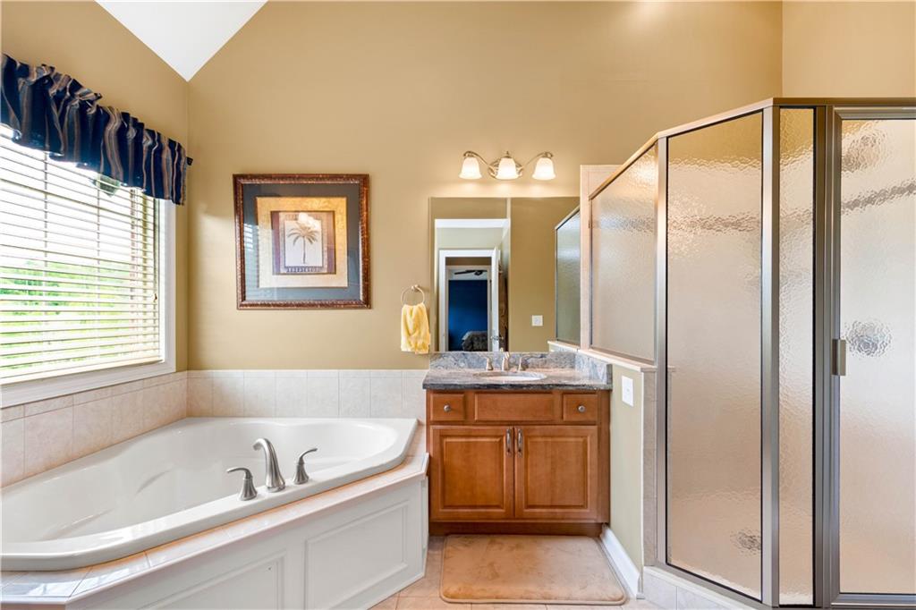 70 Barr Road Finleyville, PA 15332 - Photo 11 of 25 a bathroom with a granite countertop tub sink and mirror