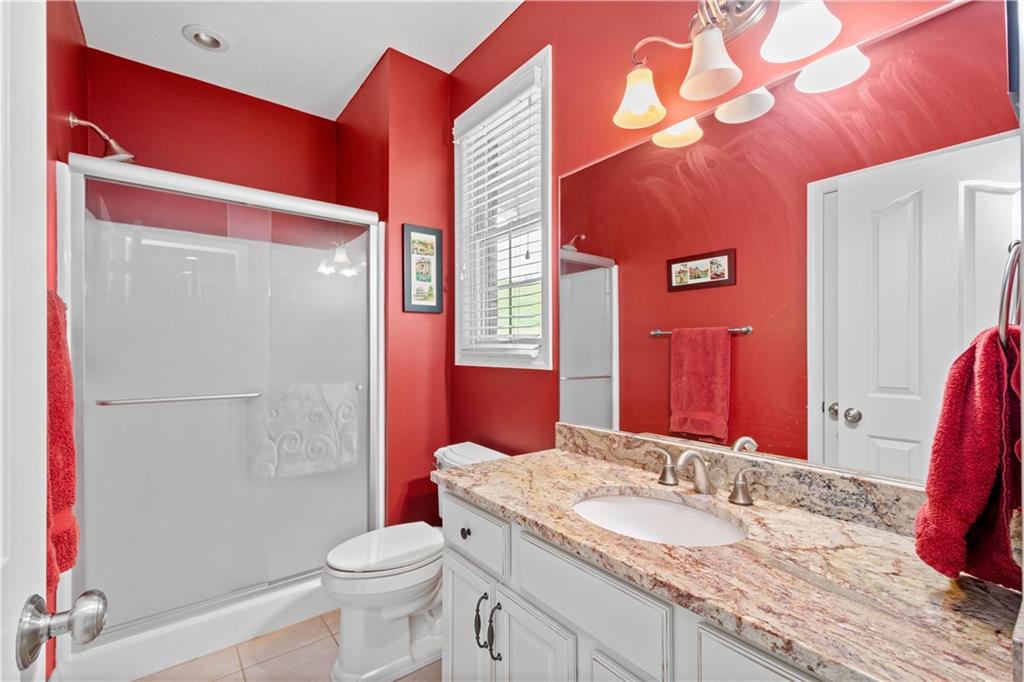 70 Barr Road Finleyville, PA 15332 - Photo 13 of 25 a bathroom with a granite countertop toilet sink and mirror