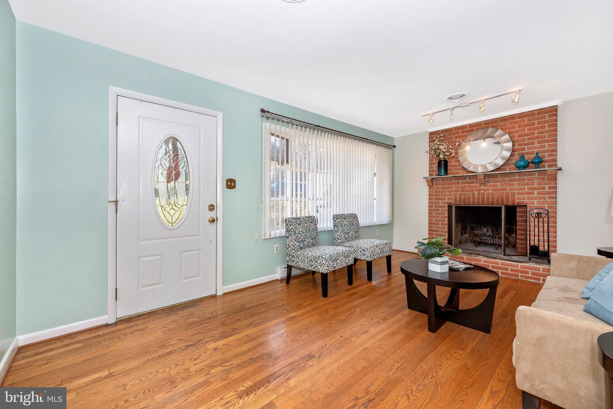 7716 McKaig Road Frederick, MD 21701 - Photo 9 of 47 LIVING ROOM W/ WOOD BURNING FIREPLACE