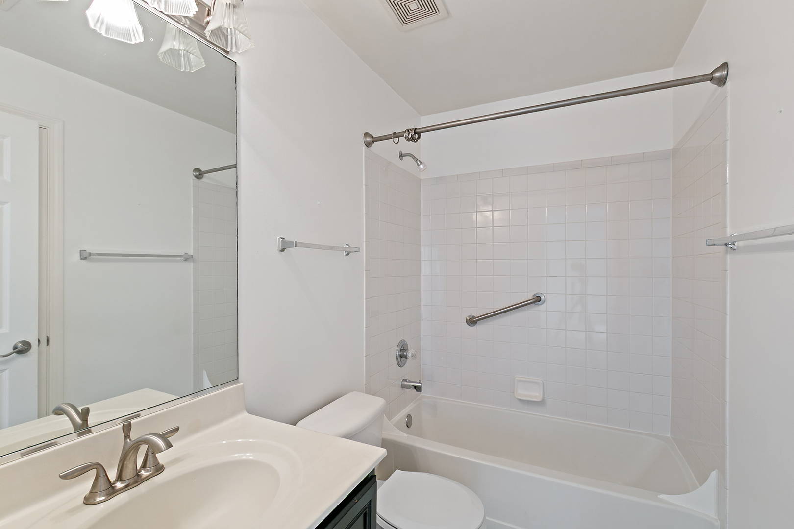 2604 Sheehan Court, Unit 204 Naperville, IL 60564 - Photo 15 of 19 a bathroom with a bathtub shower sink vanity and toilet