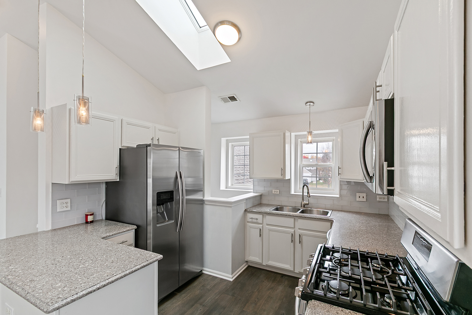 2604 Sheehan Court, Unit 204 Naperville, IL 60564 - Photo 7 of 19 a kitchen with a refrigerator a sink and a stove