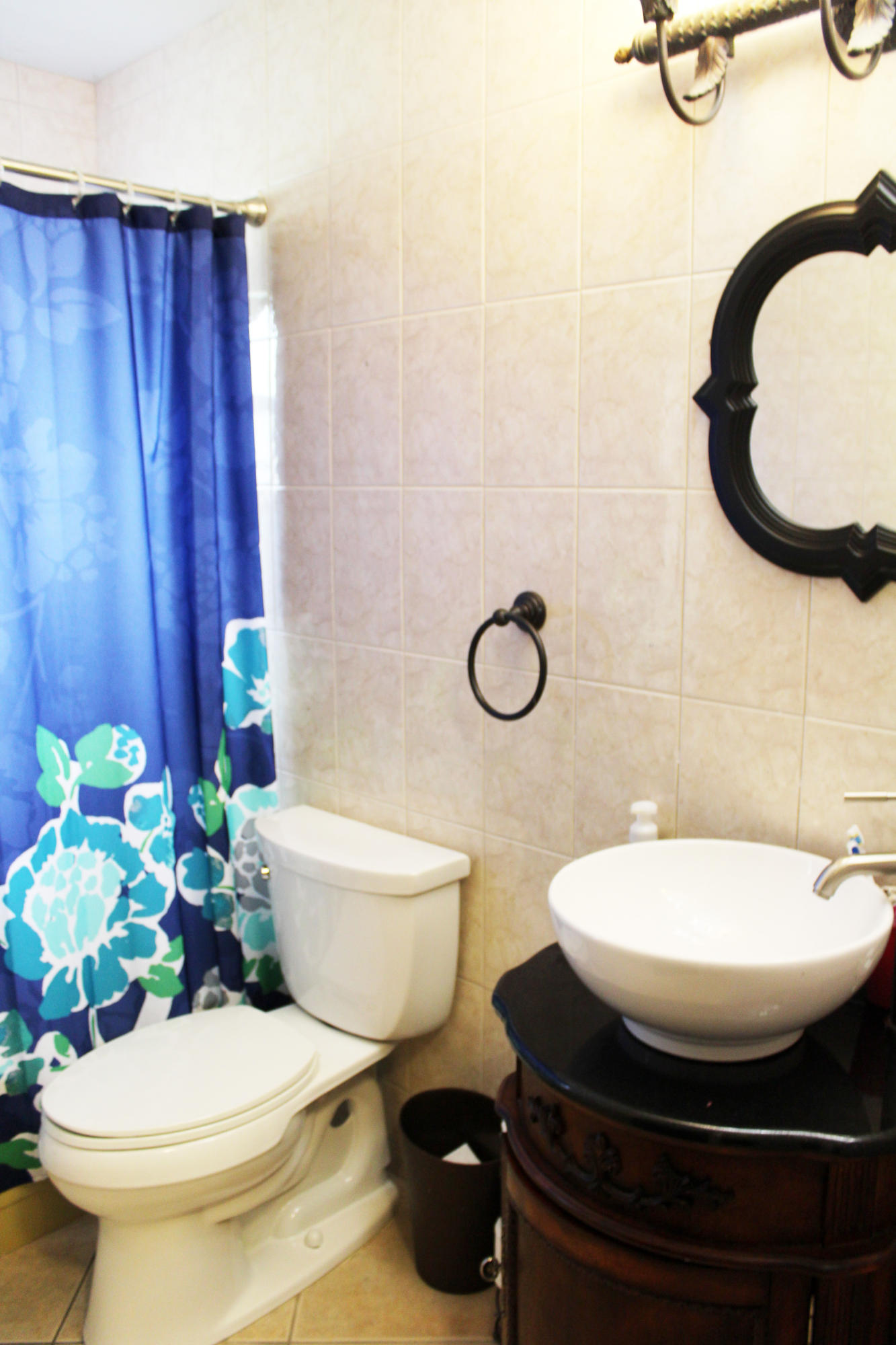 22787 Southwest 65th Way Boca Raton, FL 33428 - Photo 16 of 18 a bathroom with a sink mirror vanity and toilet
