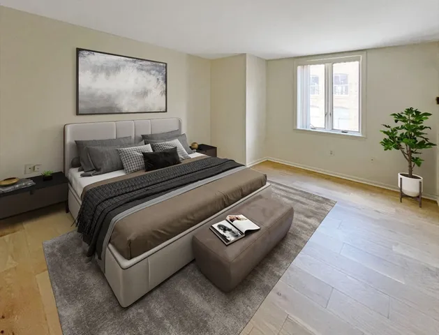 a bedroom with bed and window