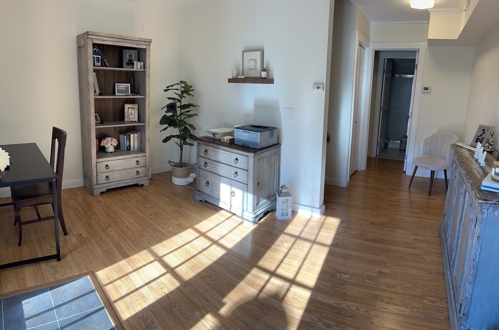 450 Rock Street, Unit 1 Fall River, MA 02720 - Photo 16 of 22 a living room with furniture rug and wooden floor