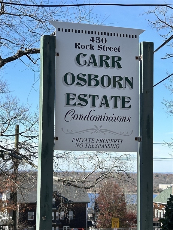 450 Rock Street, Unit 1 Fall River, MA 02720 - Photo 22 of 22 a sign on a wall next to a building