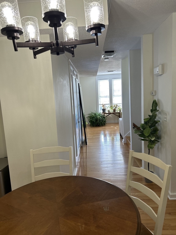 450 Rock Street, Unit 1 Fall River, MA 02720 - Photo 5 of 22 a view of a livingroom with furniture and wooden floor
