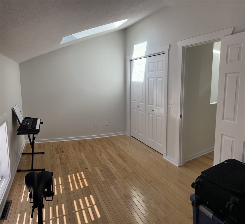 450 Rock Street, Unit 1 Fall River, MA 02720 - Photo 10 of 22 a view of empty room with wooden floor