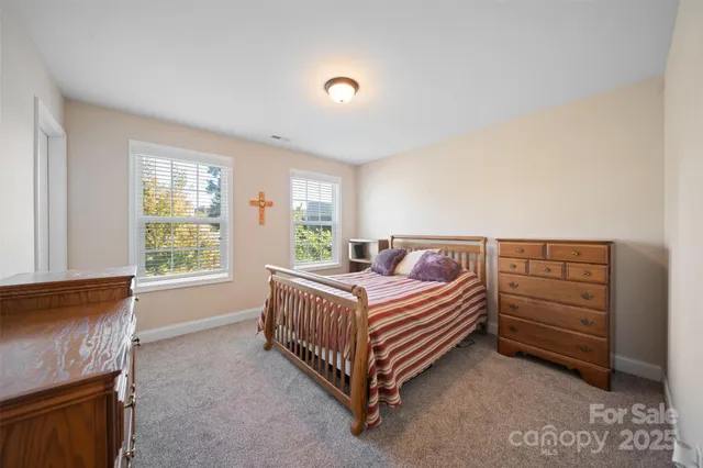 a bed room with a bed and a window