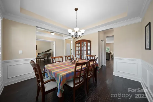 a view of a dining room with furniture and window