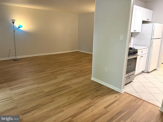 a view of kitchen and wooden floor