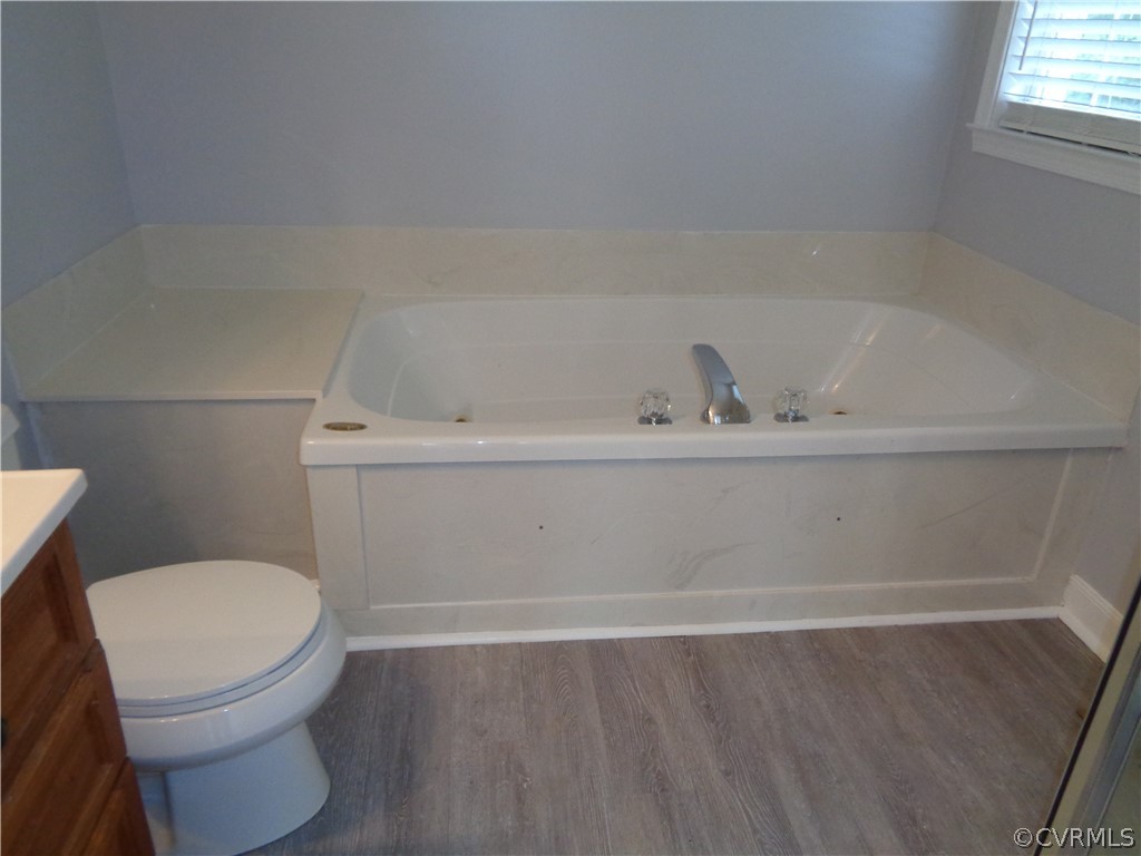 2411 Brookforest Road Midlothian, VA 23112 - Photo 12 of 24 a bathroom with a toilet and a bathtub