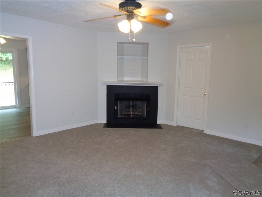 2411 Brookforest Road Midlothian, VA 23112 - Photo 16 of 24 a room with fireplace and fan