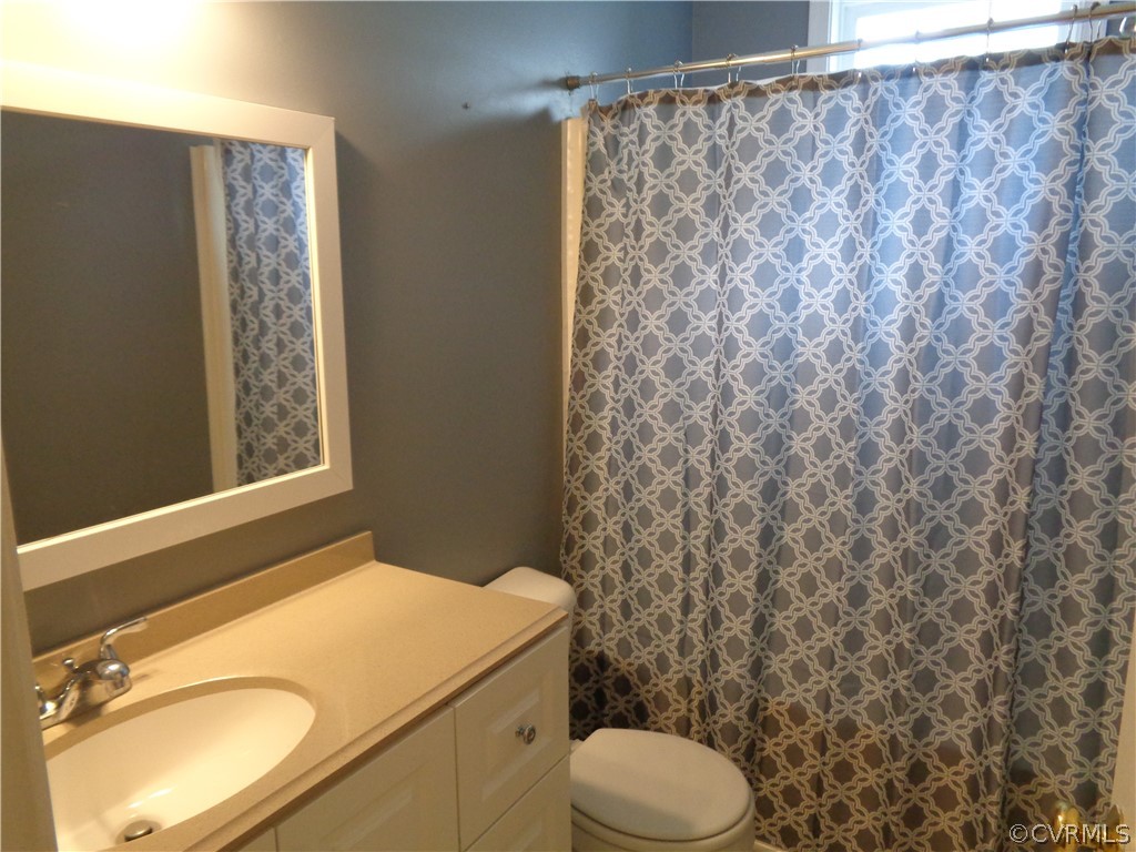 2411 Brookforest Road Midlothian, VA 23112 - Photo 18 of 24 a bathroom with a granite countertop sink and a mirror