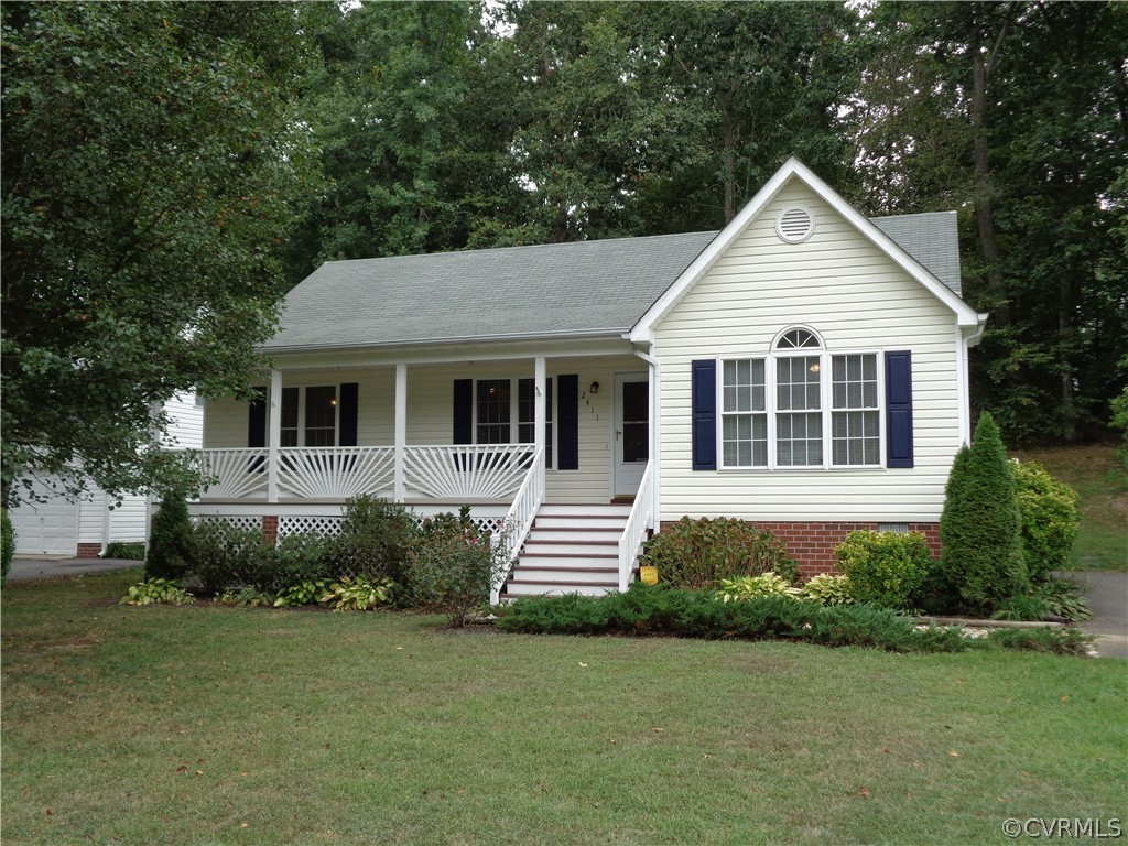 2411 Brookforest Road Midlothian, VA 23112 - Photo 2 of 24 a front view of a house with a garden