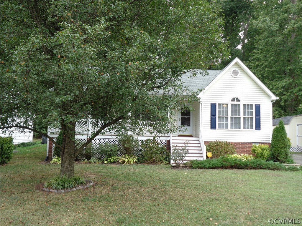 2411 Brookforest Road Midlothian, VA 23112 - Photo 4 of 24 a front view of a house with a garden