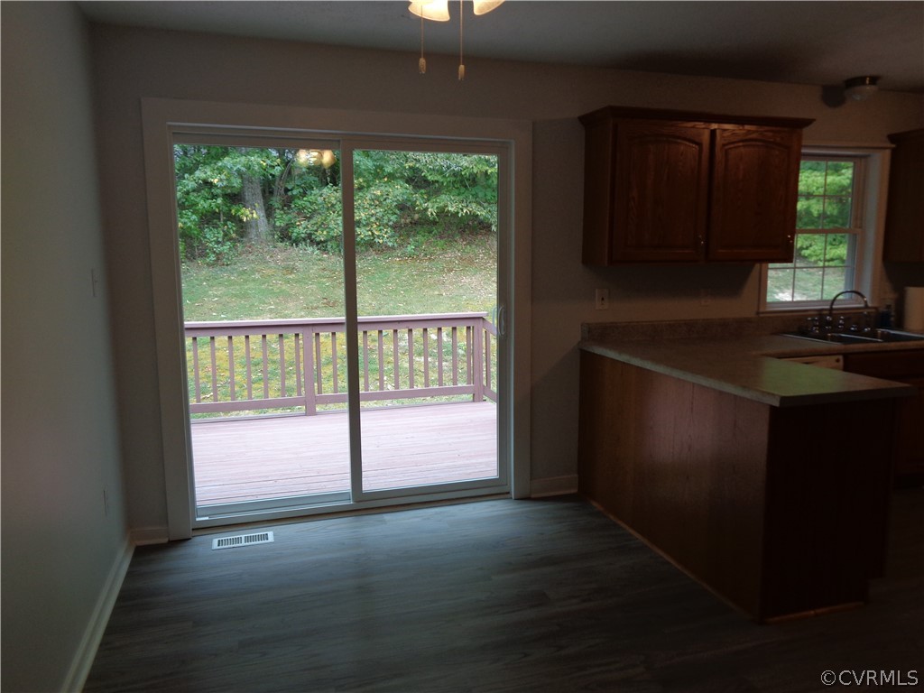 2411 Brookforest Road Midlothian, VA 23112 - Photo 8 of 24 a view of empty room with wooden floor and fan