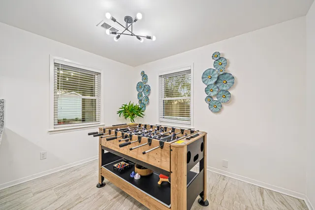 a view of an entryway with wooden floor