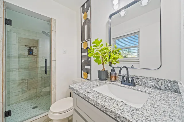 a view of an chairs and table in the patio