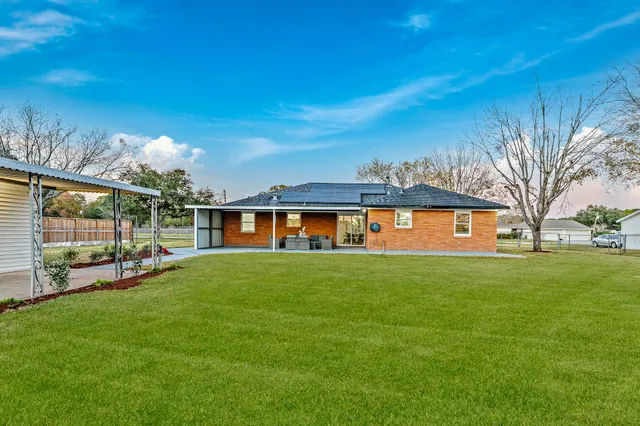 a living room with furniture and flat screen tv