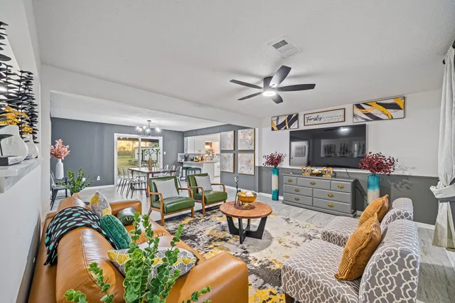 a living room with furniture and a flat screen tv