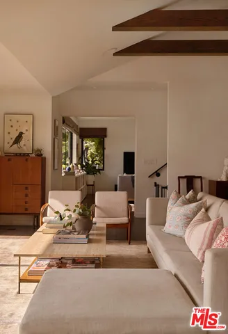 a living room with furniture and a table