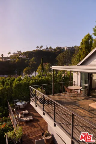 a bathroom with a large tub sink and mirror