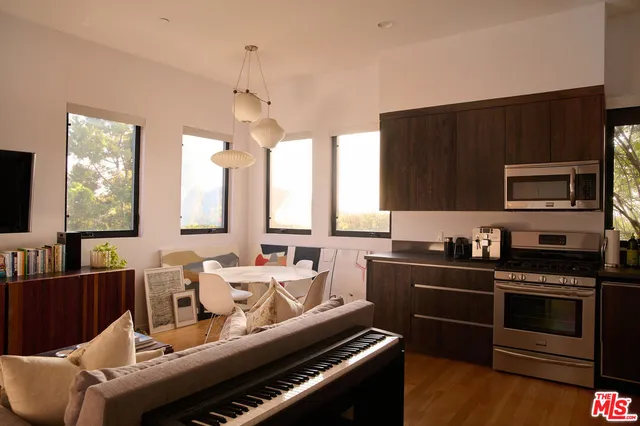 a view of a house with wooden deck