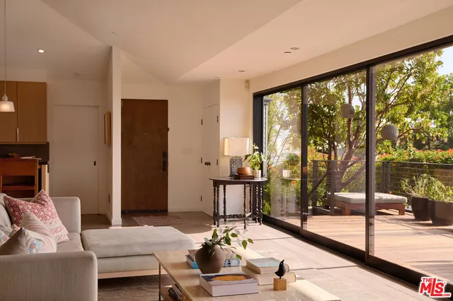 a lobby with furniture and floor to ceiling window
