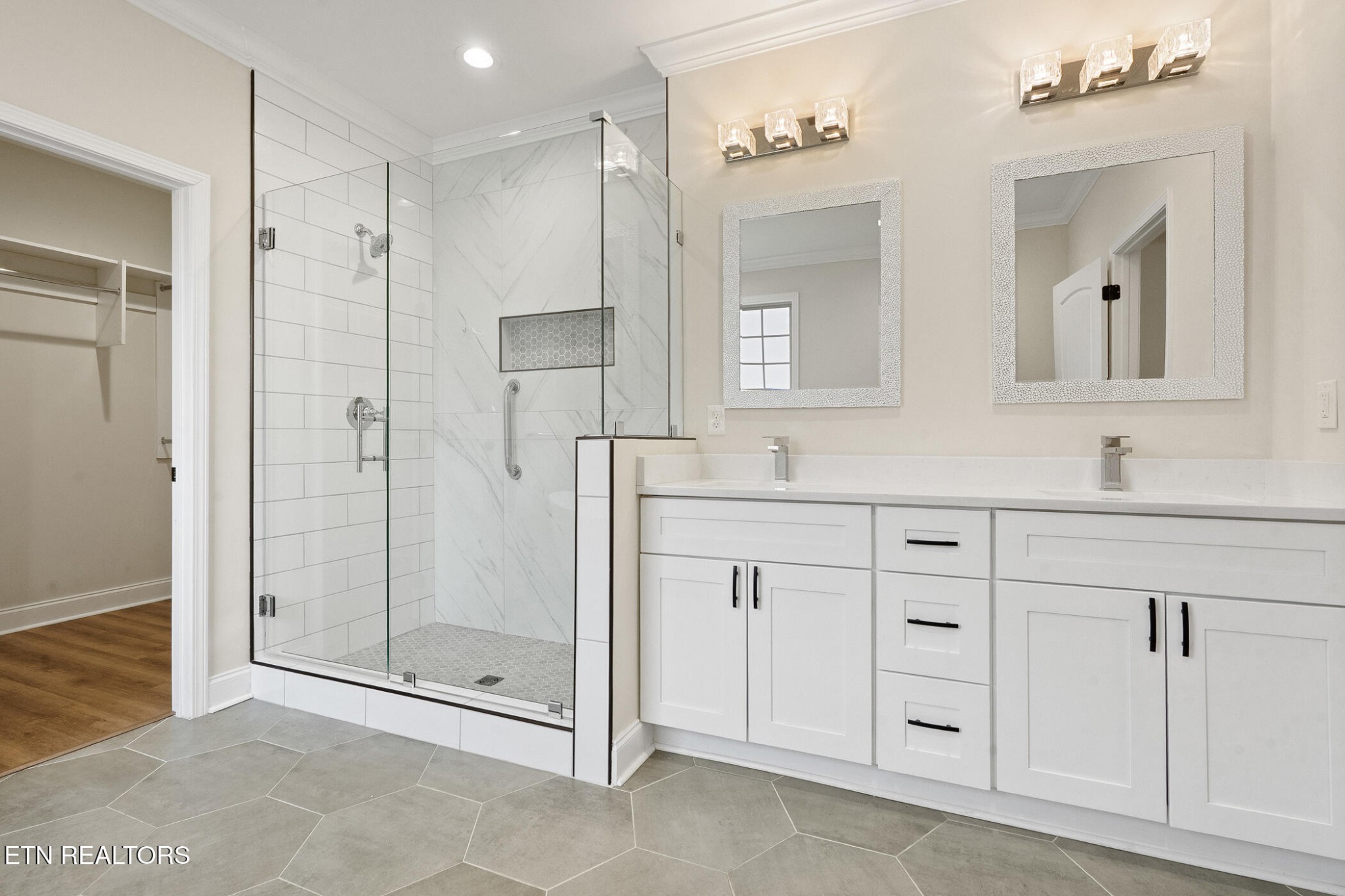 129 Ogana Way Loudon, TN 37774 - Photo 13 of 32 a bathroom with a shower sink and mirror