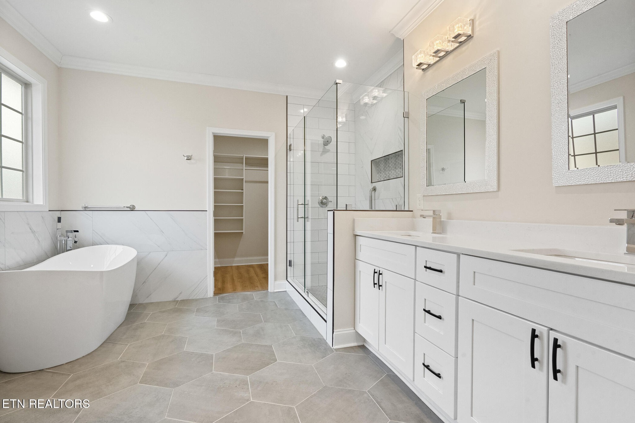 129 Ogana Way Loudon, TN 37774 - Photo 15 of 32 a spacious bathroom with a double vanity sink mirror and a bathtub