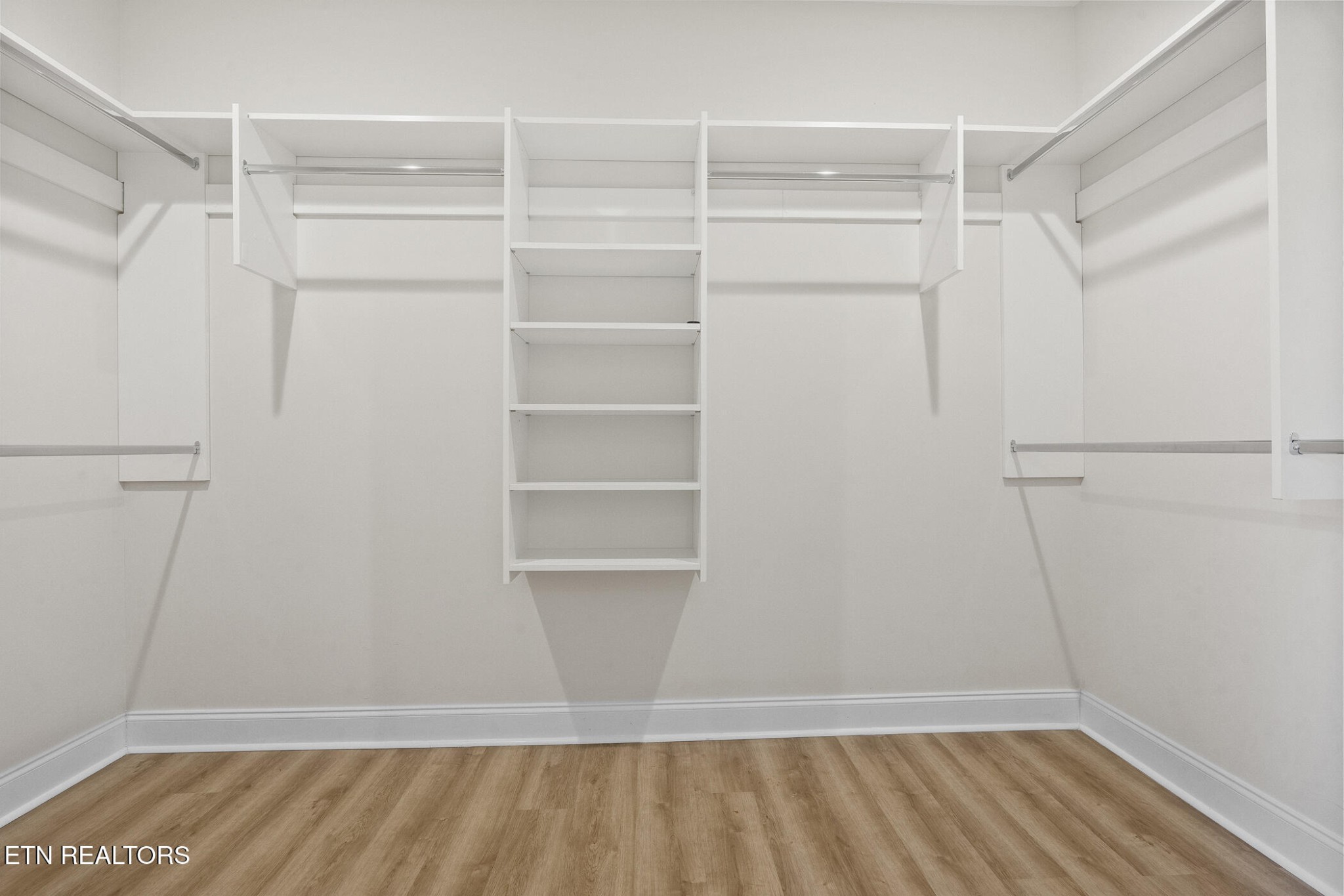 129 Ogana Way Loudon, TN 37774 - Photo 16 of 32 a view of walk in closet with empty racks