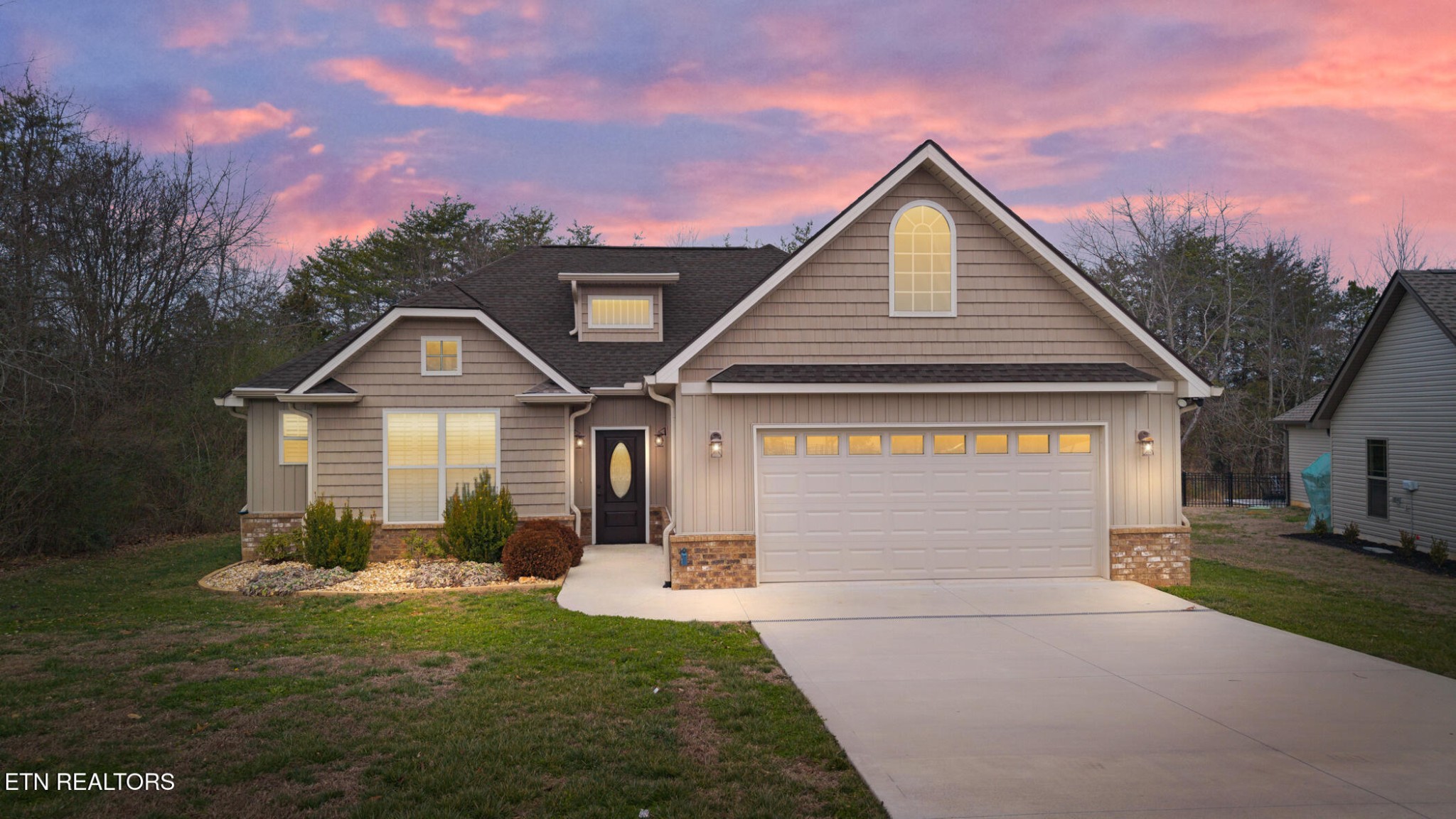 129 Ogana Way Loudon, TN 37774 - Photo 2 of 32 a front view of a house with garden