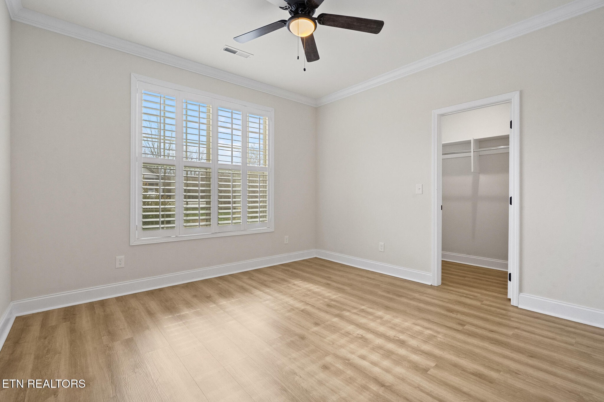 129 Ogana Way Loudon, TN 37774 - Photo 23 of 32 a view of an empty room with wooden floor and a window