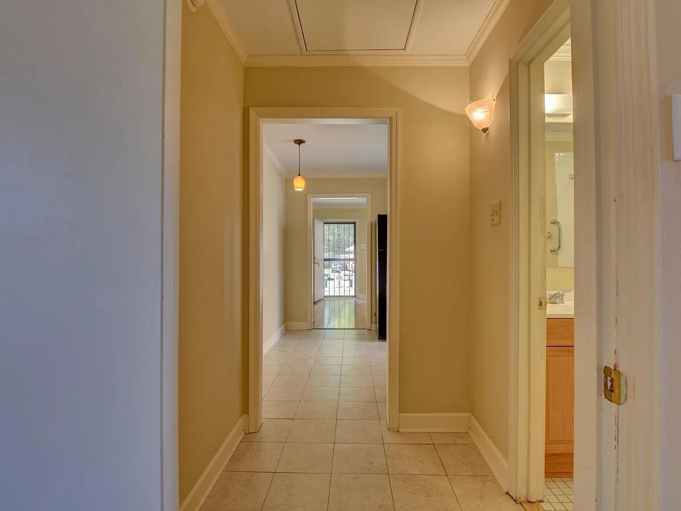 370 South Fenwick Road Memphis, TN 38111 - Photo 13 of 13 Hallway featuring crown molding and light tile patterned floors