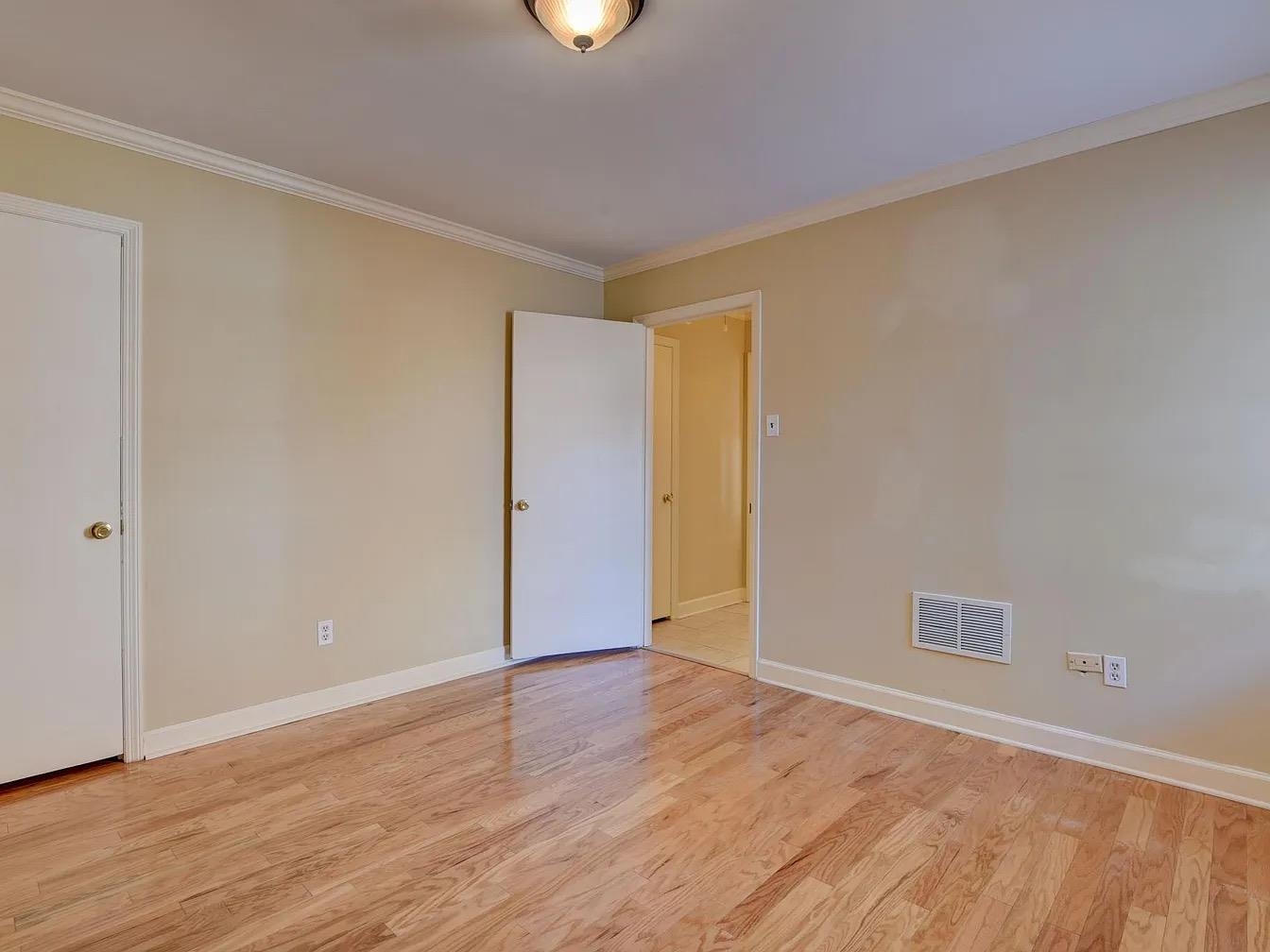 370 South Fenwick Road Memphis, TN 38111 - Photo 10 of 13 Spare room featuring light wood-type flooring and ornamental molding
